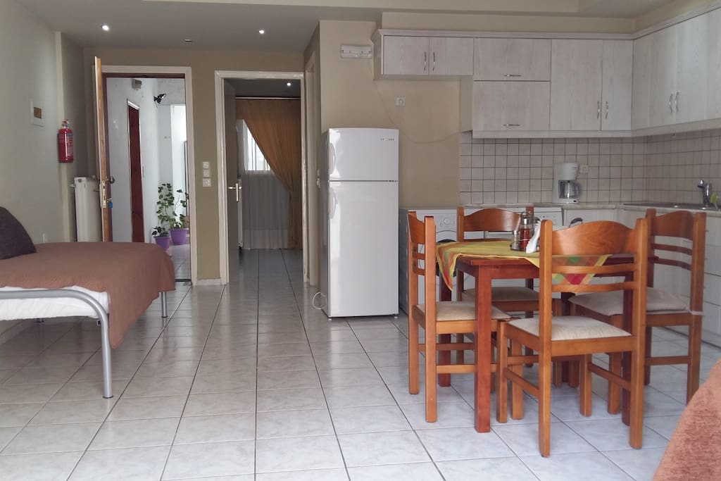 Open plan kitchen living room with TV, WIFI access, air condition,two singels beds and balcony.