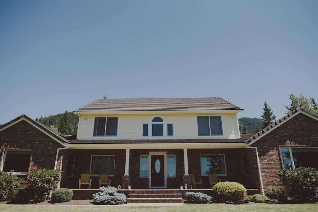 Front of house - big porch to view the fields and mountains!