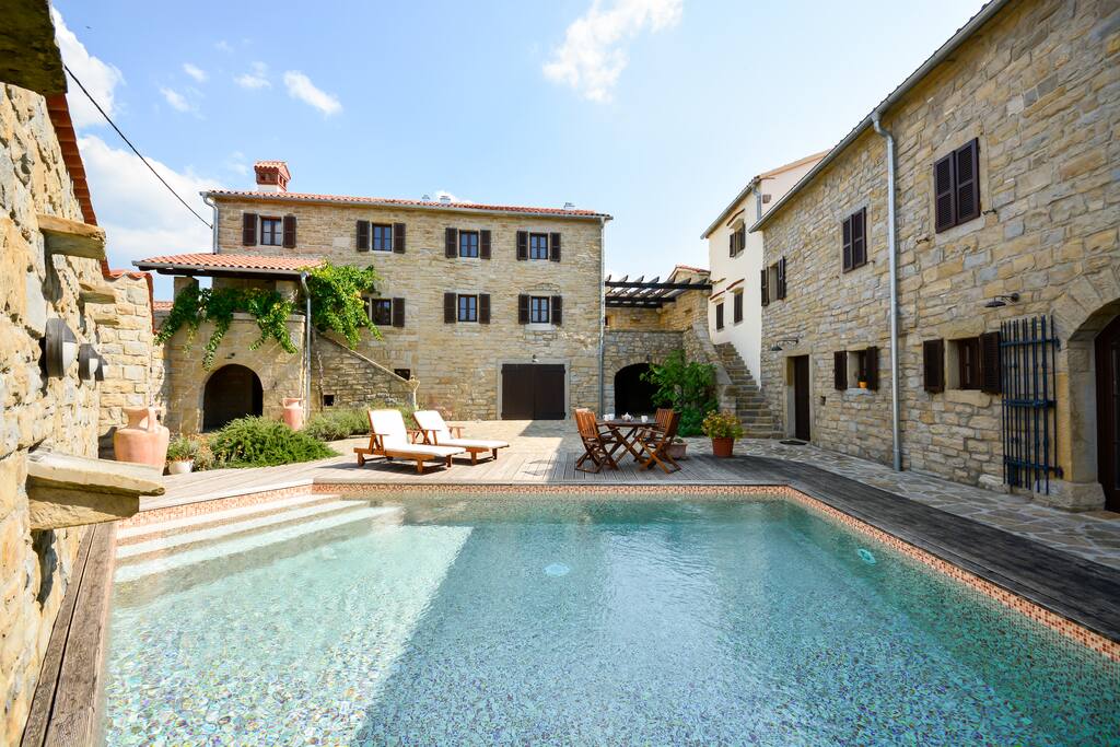 Enclosed by a courtyard that is accessed through the double doors from the kitchen