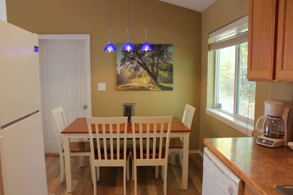 Kitchen and dining room, 4 chairs and a bench, high chair if needed.