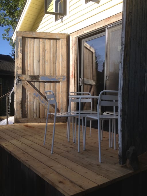 Historic garage doors frame triple paned slider.