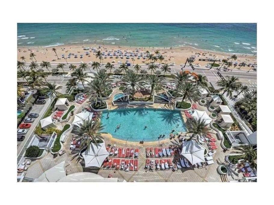 Panoramic view of the pool area and beach.