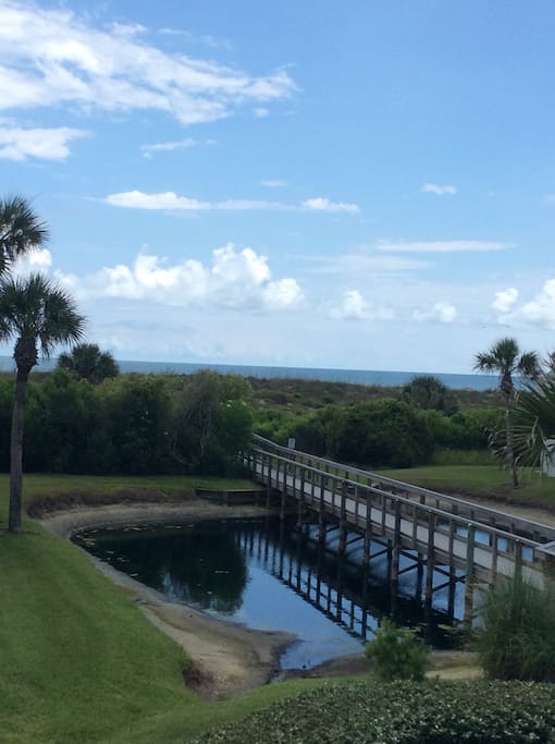 Walkway to the beach with an outdoor shower