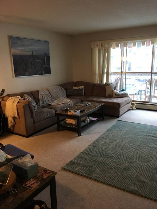 Living room space is open, comfortable and set up for games, movies and tea.