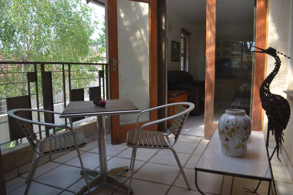 Peaceful patio in a magnificent tree canopy. Opens onto bedroom and lounge area.
