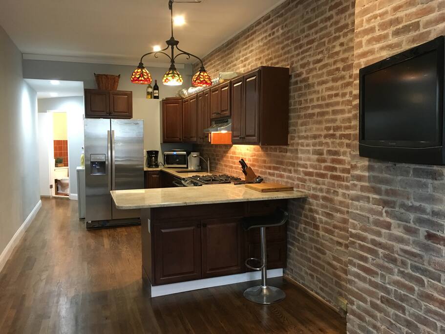 Brand new kitchen. New cabinets and stainless steel appliances, new refinished hardwood floors, granite, freshly painted