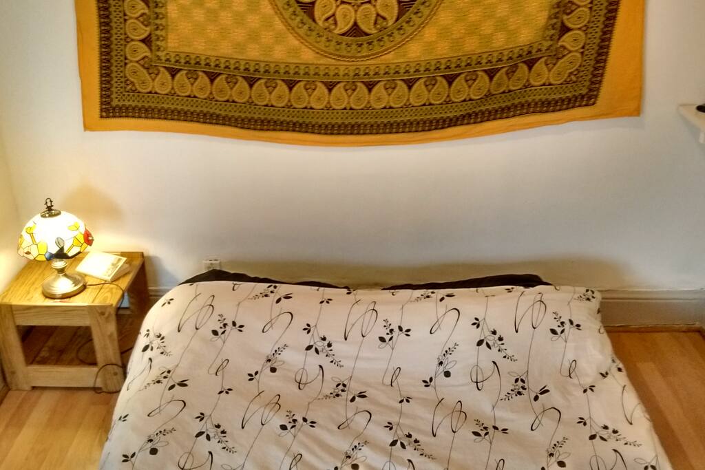 The bed is super comfortable, and tucked away in a cozy nook of the bedroom