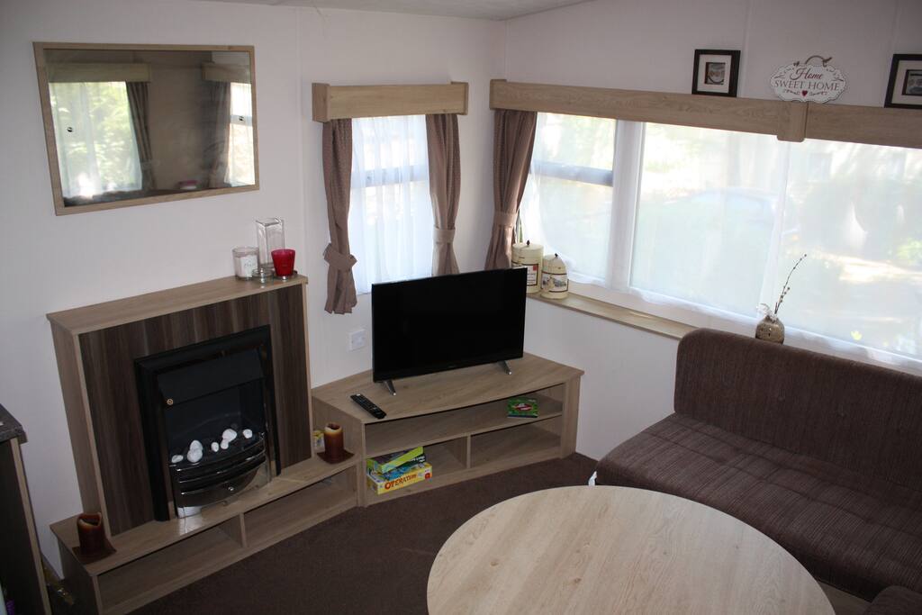 Living room with 32" TV/DVD, Gas Fire, Dining Table, Pull-out Bed Settee