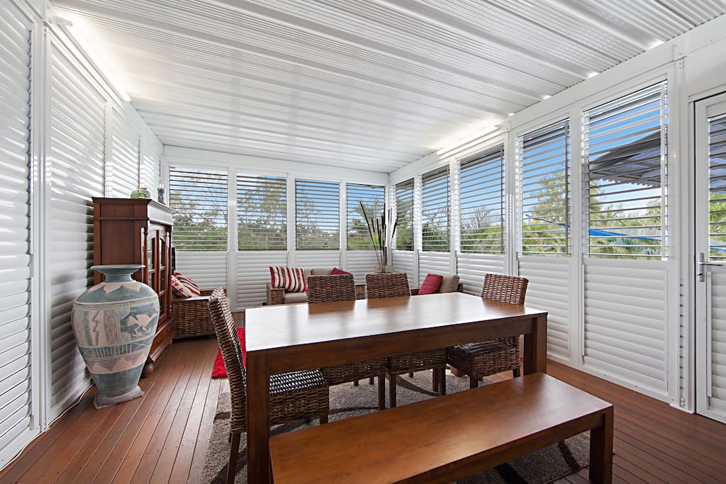 Large enclosed patio with louvre shutters & flyscreens