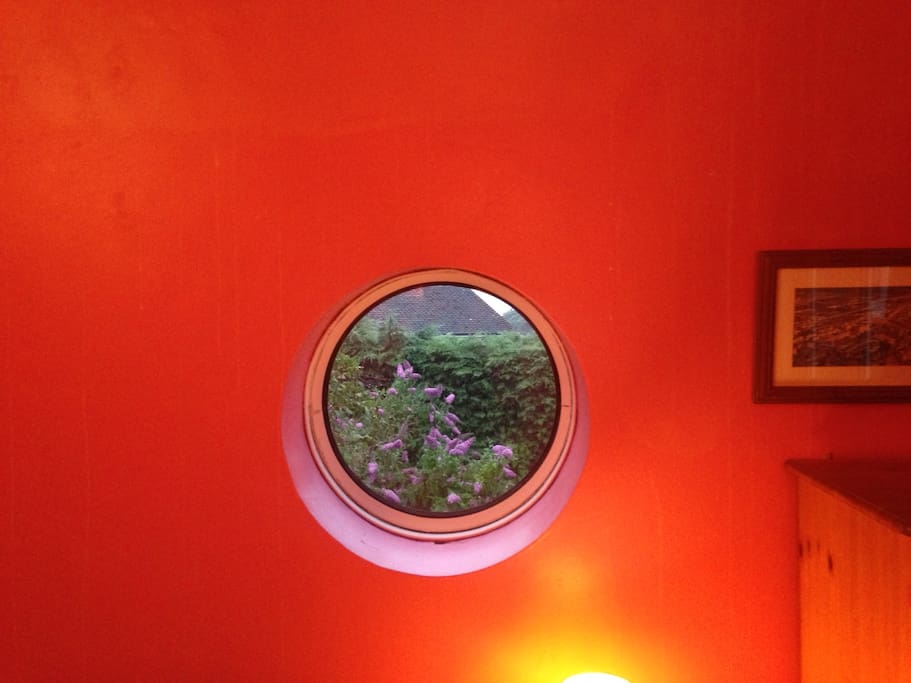 The South window overlooks the garden, and in the distance a 900 year-old church, and the sea.