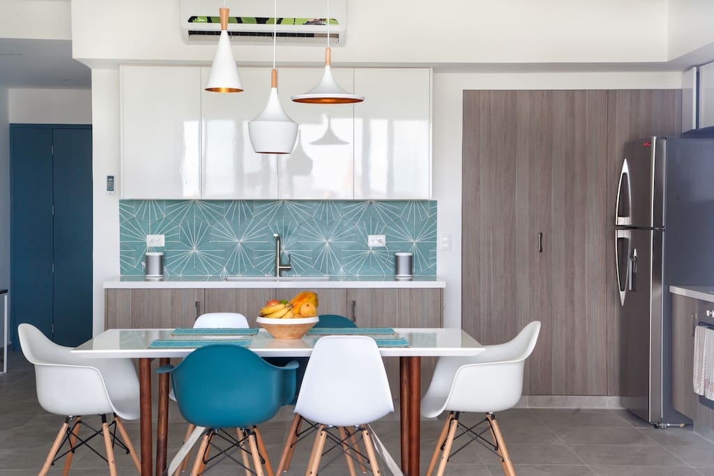 Spacious dining room with handmade Mexican tiles for the back splash.