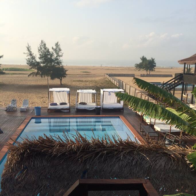 Cabana's and pool deck and ocean view seen from roof terrace
