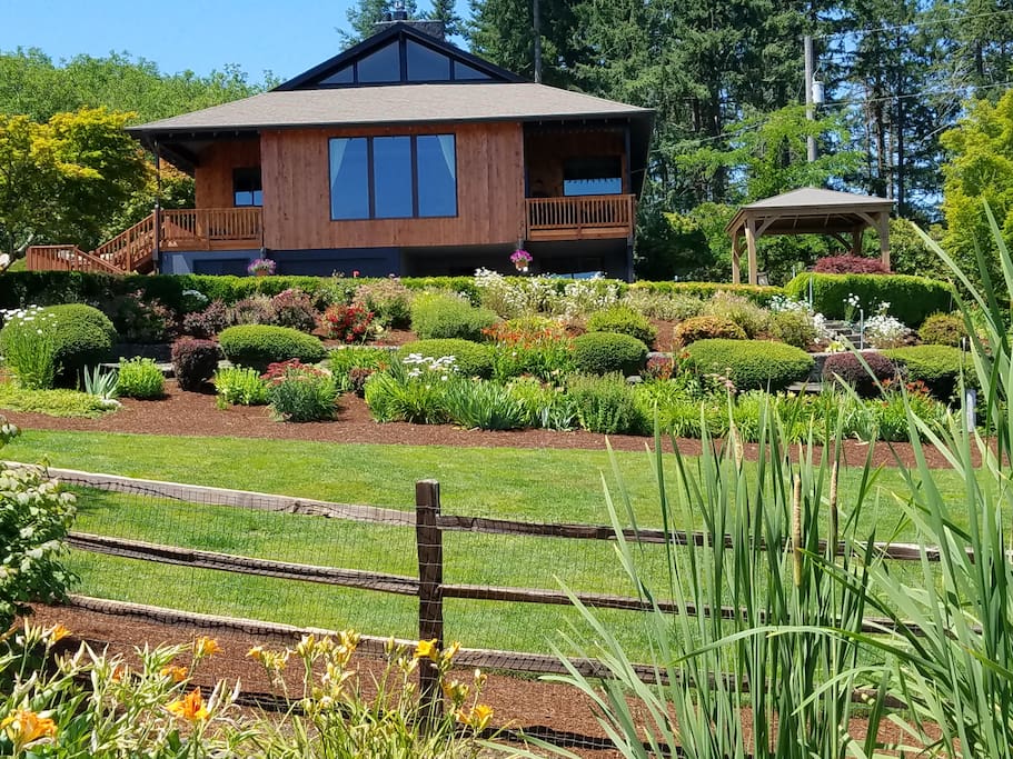 The front garden view from the pond looking toward the Pondview home.