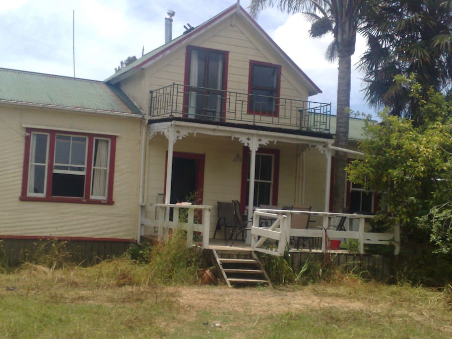 The front of the house facing south and facing the river. The top story is where the upstairs bedroom with balcony is located.