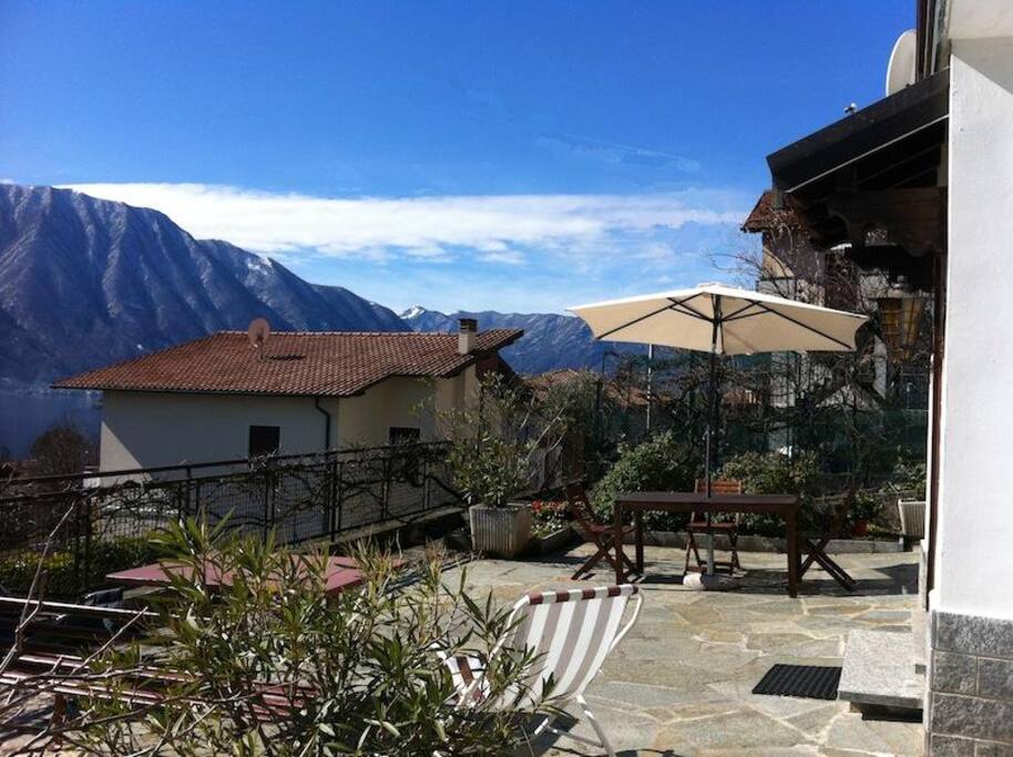 Large terrace at the front of the house captures the morning sun with wide views to the Lake