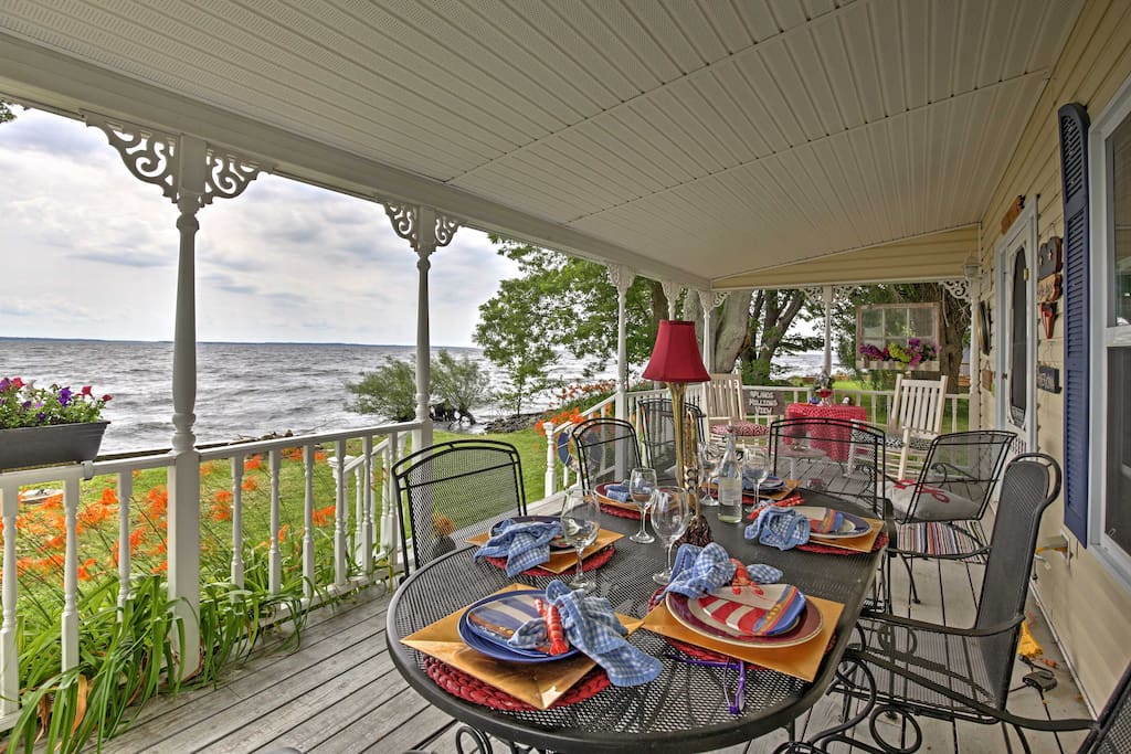 Relax on the covered front porch and take in the stunning views of Lake Ontario.
