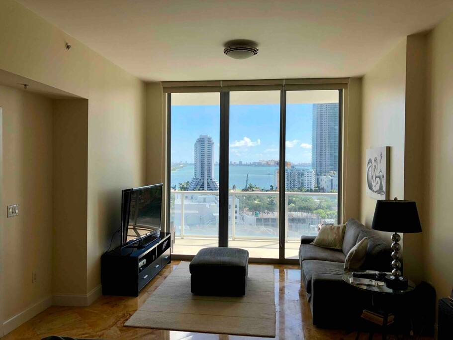 Living room with a direct water view