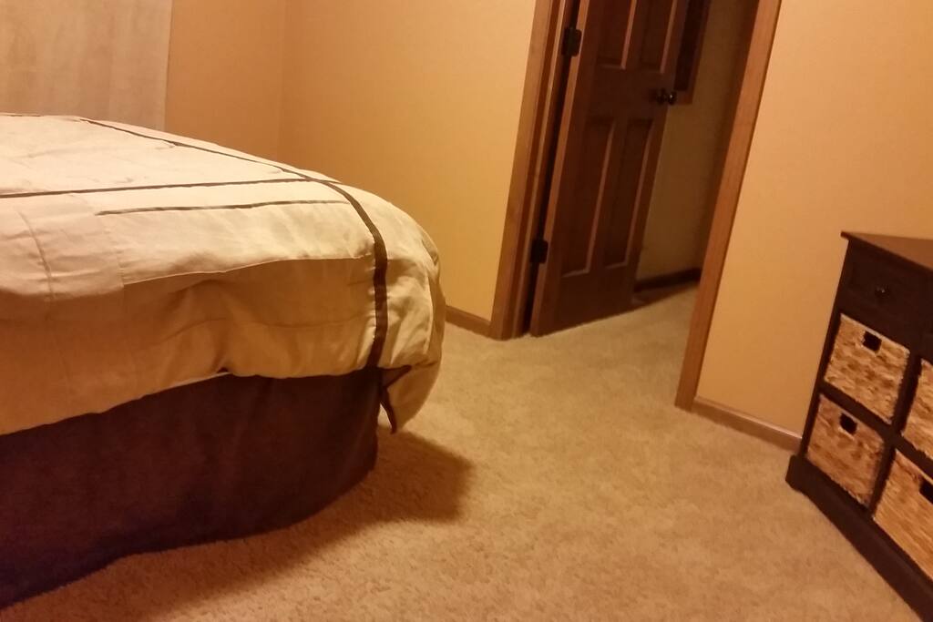 Bedroom with walk in closet, and smaller dresser chest