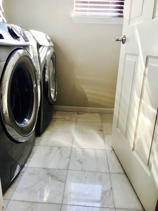 Laundry room with iron/ board