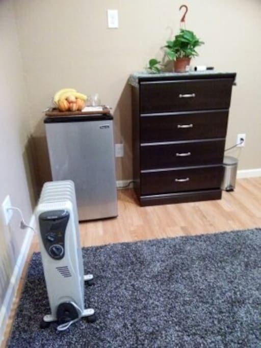 Small refrigerator and dresser.