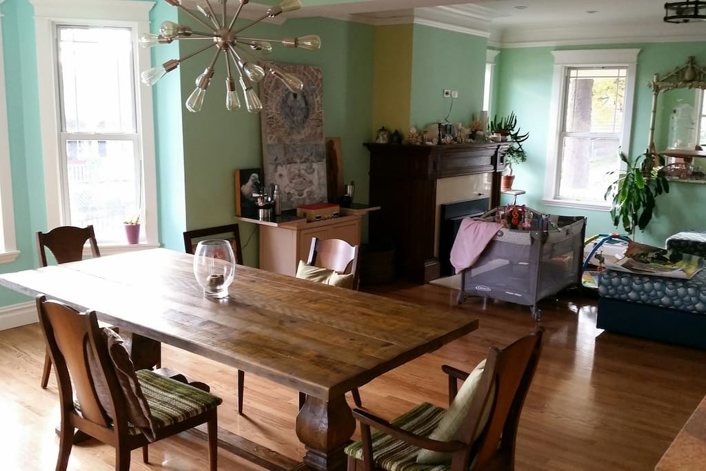 Spacious, open plan living room/dining room with gas fireplace and hardwood floors