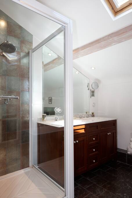 bath, shower and twin sinks