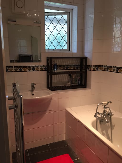 Bathroom with shower and bathtub.