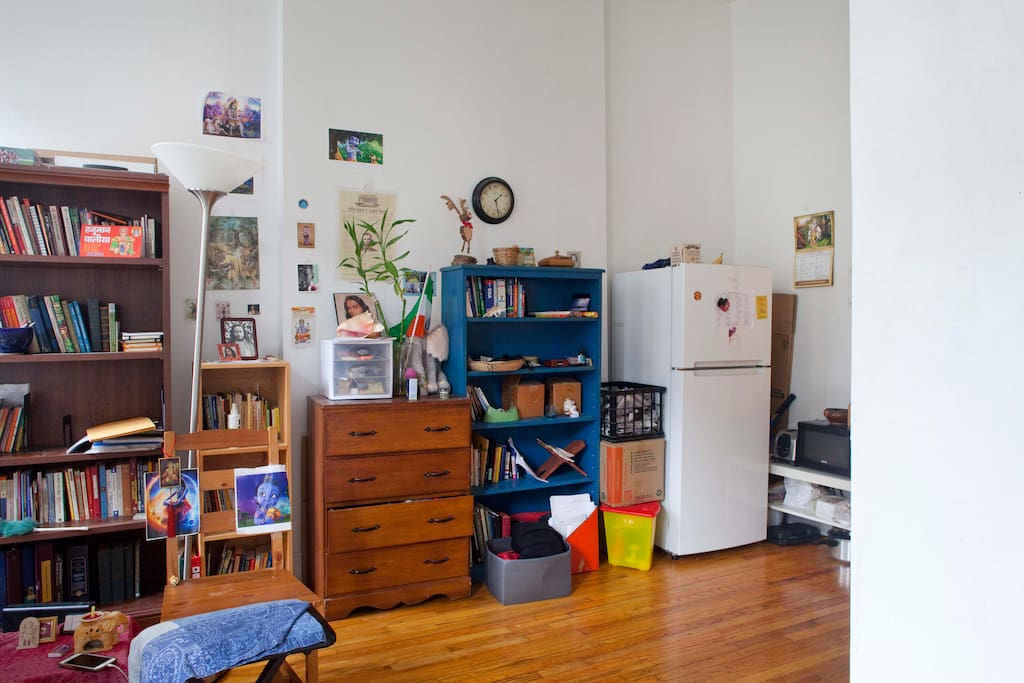 Living area with refrigerator and microwave.