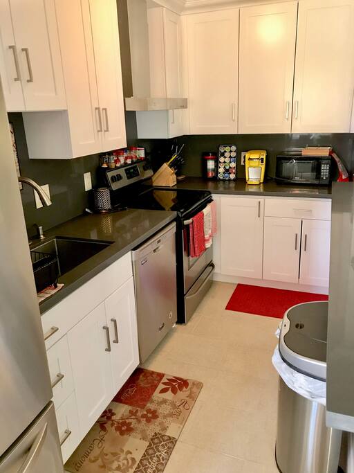 Kitchen with all appliances, Keurig, dishwasher, fridge, dishes, condiments, etc.