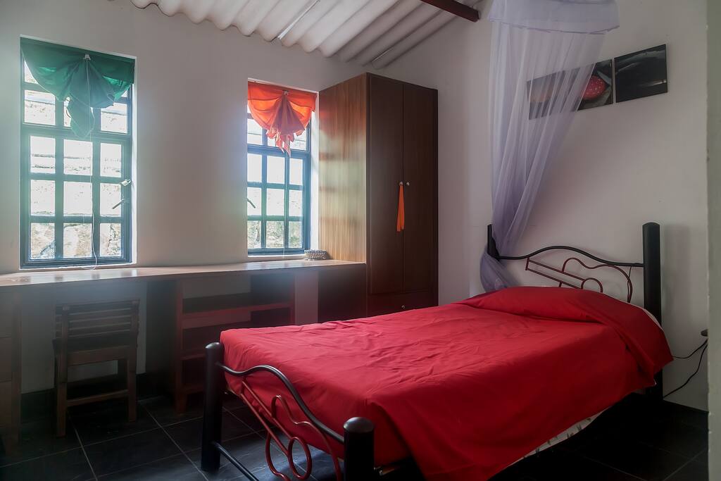 Single Room with the view to the one side of the house, you will see the Rock and terraces with vegetables and fruits. Nice to relax, read, write or drawing.