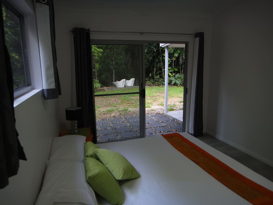 Main bedroom with king bed and outside access