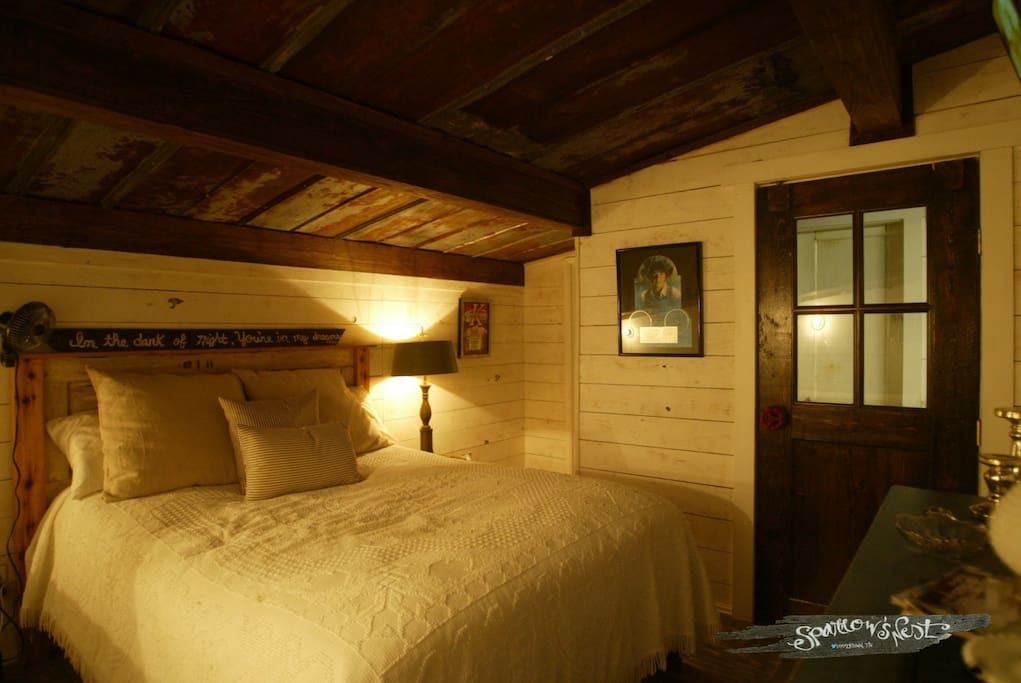 Master bedroom with music memorabilia and TV