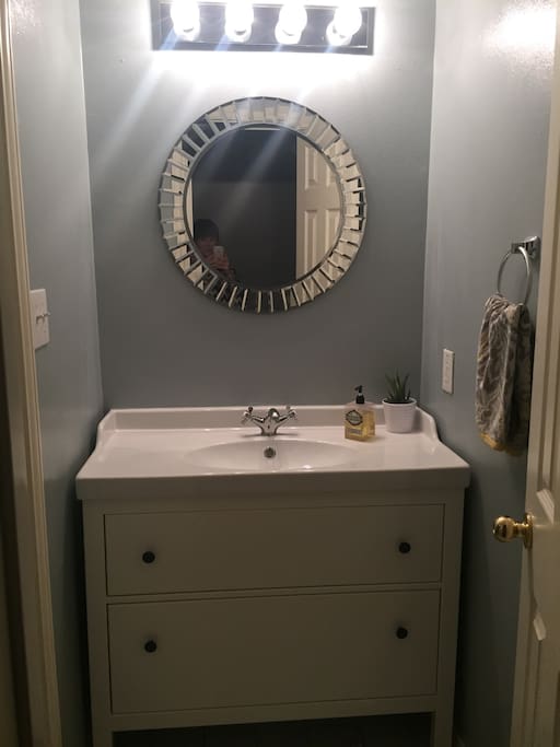 Guest bathroom - stocked with hair dryer, new towels and shampoo/body wash in case you forget