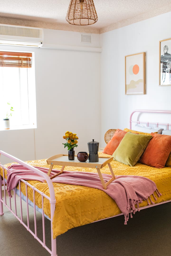 Spacious main bedroom with comfortable queen