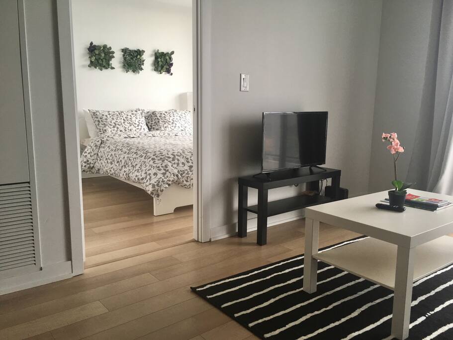 Living room with bedroom behind it