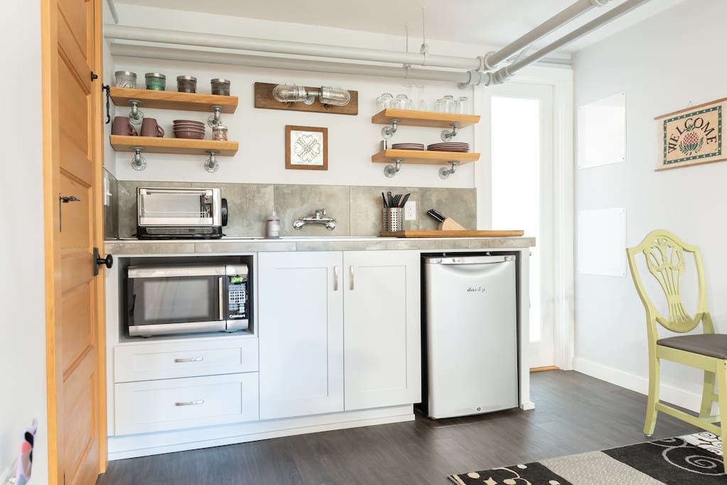 Kitchenette with sink, fridge, micro, toaster oven, coffee maker, etc.