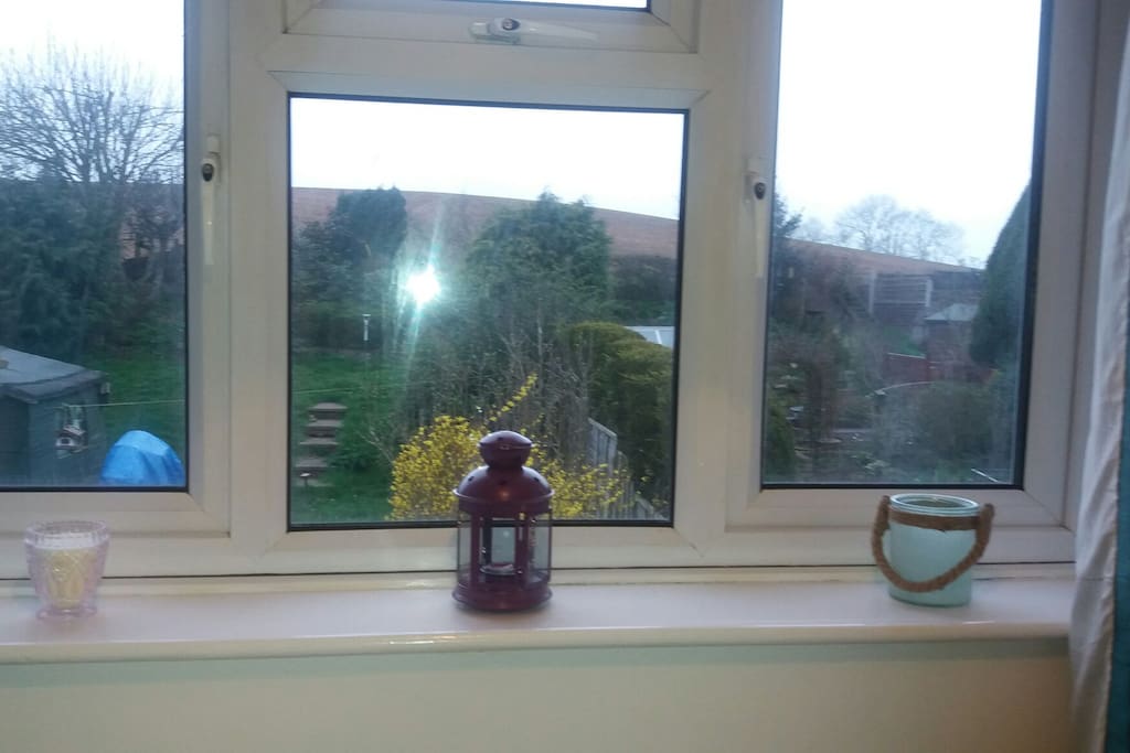 Room is at the back of the house looking out to fields.