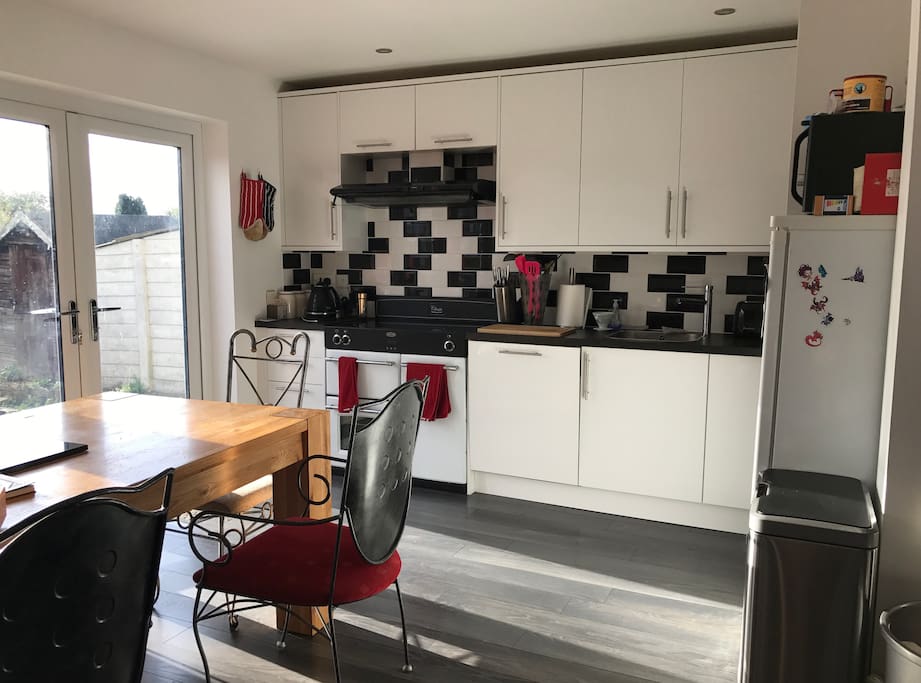 Our lovely kitchen with its optical illusion tiles that look all wonky but aren't it's hard to get the right angle for it, this is the wonkiest I've been able to make them look! Hob is digital induction, layout is very logical, bin is also electric so you just wave your hand over it and it opens.