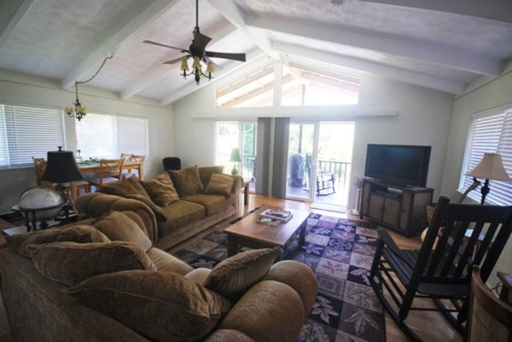 Comfortable family room with ocean and garden views out every window