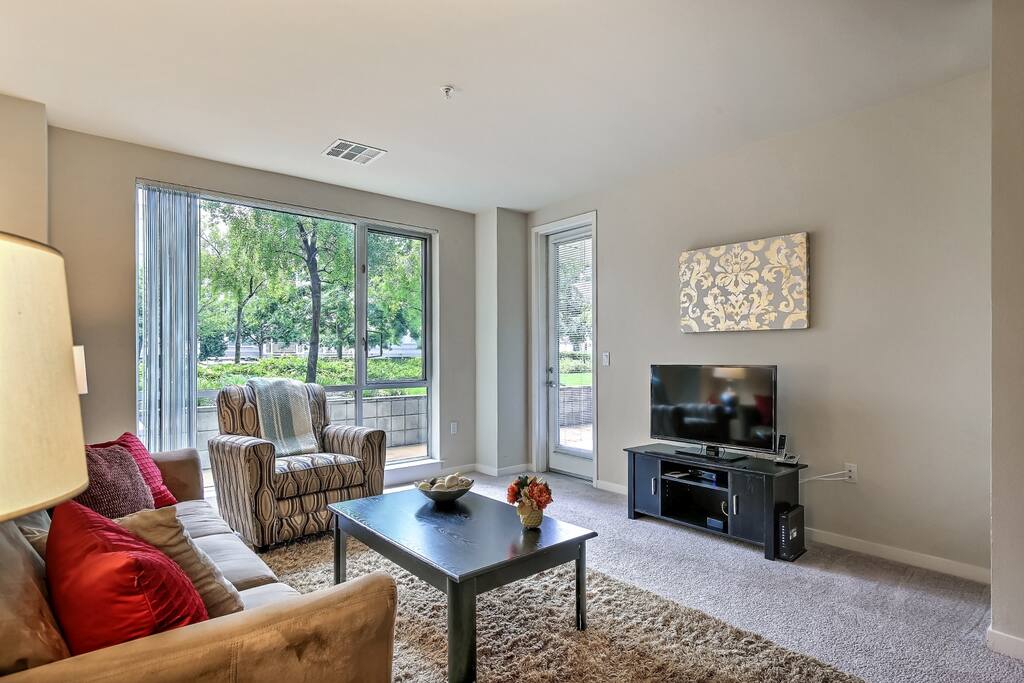 Living room with entry to private patio