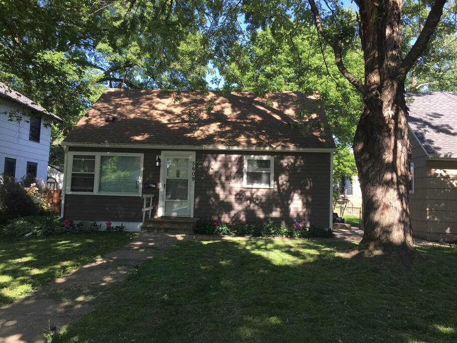 Front of the house, with a new siding color.