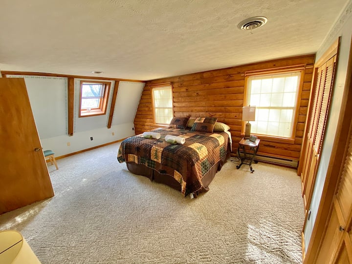 Master bedroom. King size bed, night stands, 2 closest & wireless charges.