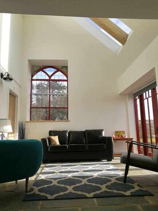 beautifully light, cosy, open plan living room with lovely countryside views