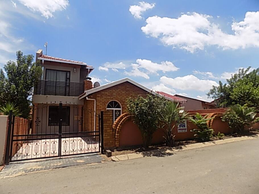 Outside of the house with 1 parking space.