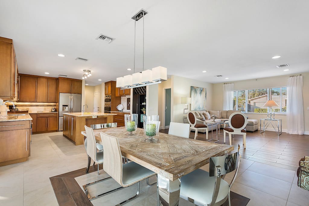 The open living room, dining area, and kitchen offers a great flow for entertaining.