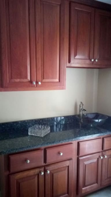 Wash up sink inside back door in the laundry room