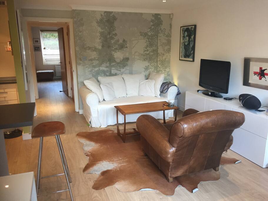 Sitting area with view of corridor to bedroom & bathroom