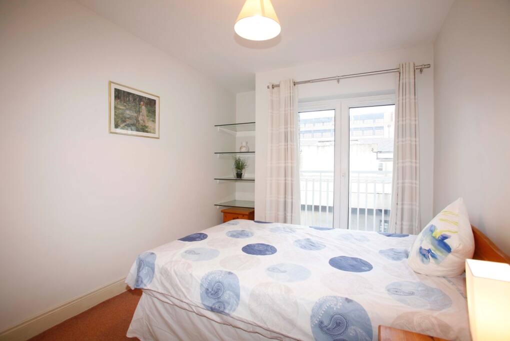 Bright bedroom with double balcony