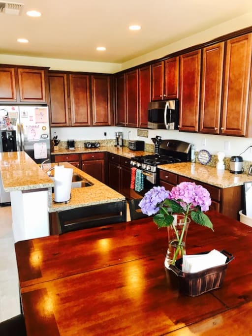 Whip up a delicious meal in our full-size KITCHEN with gas stovetop/oven, convection/ microwave oven, cookware, dishes, coffee machine, toaster, Nutri Ninja Pro Blender, and more.