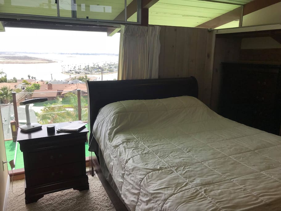Private bedroom with view and queen bed